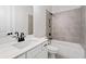 Neutral-toned bathroom featuring tub, shower, toilet, and vanity with marble countertop at 91 Batten Board Way, Woodstock, GA 30189
