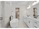 Luxurious bathroom with freestanding tub, dual sinks, and marble tile at 91 Batten Board Way, Woodstock, GA 30189