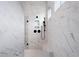 Modern bathroom showcases a large walk-in shower with stylish black fixtures and marble-style tiling at 91 Batten Board Way, Woodstock, GA 30189