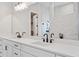 Elegant bathroom featuring double sinks, modern fixtures, and marble backsplash at 91 Batten Board Way, Woodstock, GA 30189