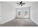 Neutral bedroom with carpeted floor, ceiling fan, and direct access to outdoor balcony at 91 Batten Board Way, Woodstock, GA 30189