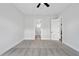 Spacious bedroom with neutral walls, gray carpet, ceiling fan, and white trim at 91 Batten Board Way, Woodstock, GA 30189