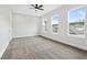 Large bedroom with natural light coming from windows, neutral walls, and light carpet at 91 Batten Board Way, Woodstock, GA 30189