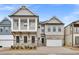 Charming two-story home with stone accents, a balcony, and a two-car garage nestled in a quiet neighborhood at 91 Batten Board Way, Woodstock, GA 30189