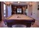 Recreation room features a billiard table, custom lighting, and ample space for entertaining at 91 Batten Board Way, Woodstock, GA 30189