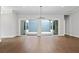 Bright living area with hardwood floors and sliding doors leading to an outdoor space at 91 Batten Board Way, Woodstock, GA 30189