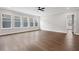 Bright and spacious living room with light colored walls, hardwood floors, and large windows at 91 Batten Board Way, Woodstock, GA 30189