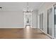 Spacious room with hardwood flooring, modern lighting, and sliding glass doors at 91 Batten Board Way, Woodstock, GA 30189