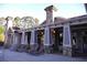 Community clubhouse with outdoor seating and lounge chairs near the swimming pool at 91 Batten Board Way, Woodstock, GA 30189
