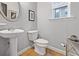 Neat and modern half bathroom with pedestal sink and toilet at 1365 Memorial Se Dr # 12, Atlanta, GA 30317