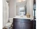 Cozy half bathroom featuring toilet, vanity, sink, mirror and new fixtures at 1365 Memorial Se Dr # 12, Atlanta, GA 30317