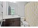 Clean bathroom featuring a modern vanity, white toilet, and stylish shower curtain at 1365 Memorial Se Dr # 12, Atlanta, GA 30317