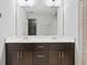 Modern bathroom featuring double vanity, granite countertop, and a large mirror at 1365 Memorial Se Dr # 12, Atlanta, GA 30317