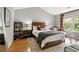 A cozy bedroom with vaulted ceiling, decorative rug, and natural light from a large window at 1365 Memorial Se Dr # 12, Atlanta, GA 30317