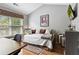 Bright bedroom with hardwood floors, natural light, and vaulted ceilings at 1365 Memorial Se Dr # 12, Atlanta, GA 30317