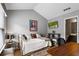 Comfortable bedroom with hardwood floors, natural light, and vaulted ceilings at 1365 Memorial Se Dr # 12, Atlanta, GA 30317
