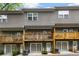 Exterior view of townhome complex featuring garages, balconies, and modern architecture at 1365 Memorial Se Dr # 12, Atlanta, GA 30317