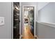 Hallway showcasing hardwood floors and dark doors, leading to various rooms in the house at 1365 Memorial Se Dr # 12, Atlanta, GA 30317