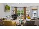Bright and inviting living room with modern furniture, a grand piano, and a large window at 1365 Memorial Se Dr # 12, Atlanta, GA 30317