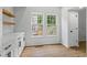 Cozy dining area with built-in cabinets and shelving, complemented by natural light from backyard views at 1909 Riverlanding Cir, Lawrenceville, GA 30046