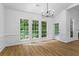 Dining room with large windows, a chandelier, and white walls and trim at 1909 Riverlanding Cir, Lawrenceville, GA 30046