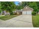 Traditional home boasting a two-car garage and a long driveway at 1909 Riverlanding Cir, Lawrenceville, GA 30046