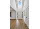 Welcoming foyer with soaring ceilings, natural light, and wood-look floors leading into the home at 1909 Riverlanding Cir, Lawrenceville, GA 30046