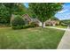Charming one-story home with manicured lawn and lush landscaping at 1909 Riverlanding Cir, Lawrenceville, GA 30046
