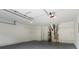 Spacious garage with epoxy floors, shelving and ample storage space at 1909 Riverlanding Cir, Lawrenceville, GA 30046