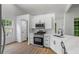 Contemporary kitchen with stainless steel appliances, white cabinets, and open layout at 1909 Riverlanding Cir, Lawrenceville, GA 30046