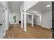 Bright living room with vaulted ceilings, fireplace, wood floors, and open floorplan to dining area at 1909 Riverlanding Cir, Lawrenceville, GA 30046