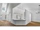 Bright and airy living space features high ceilings, modern bar with seating, and open floor plan at 1909 Riverlanding Cir, Lawrenceville, GA 30046