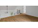 Bright loft space features wood-look floors, white railing, and natural light from the exterior at 1909 Riverlanding Cir, Lawrenceville, GA 30046