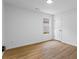 This room has a neutral design featuring wood-look flooring and a bright window at 1909 Riverlanding Cir, Lawrenceville, GA 30046