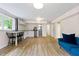 Spacious basement with modern kitchenette, laminate flooring, and ample natural light at 4265 Hidden Valley Dr, South Fulton, GA 30349