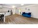 Open-concept basement featuring a stainless steel refrigerator and comfortable seating area at 4265 Hidden Valley Dr, South Fulton, GA 30349