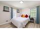 Comfortable bedroom with wood-look flooring, light walls, and a window bringing in natural light at 4265 Hidden Valley Dr, South Fulton, GA 30349