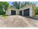 Detached garage with ample parking space and a well-maintained exterior at 4265 Hidden Valley Dr, South Fulton, GA 30349