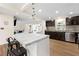 Modern kitchen with marble countertops, stainless steel appliances, and a breakfast bar at 4265 Hidden Valley Dr, South Fulton, GA 30349