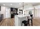 Well-lit kitchen with a breakfast bar, modern appliances, and stylish flooring at 4265 Hidden Valley Dr, South Fulton, GA 30349
