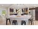 Modern kitchen features a marble island, stainless steel appliances, and pendant lighting at 4265 Hidden Valley Dr, South Fulton, GA 30349