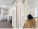 Functional laundry room with tiled flooring and cabinetry adjacent to a doorway to a carpeted room at 4265 Hidden Valley Dr, South Fulton, GA 30349