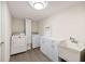 Well-equipped laundry room with modern appliances, cabinetry, and a utility sink at 4265 Hidden Valley Dr, South Fulton, GA 30349