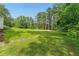 A expansive, well-maintained lawn and mature trees showcase this home's great outdoor space at 4265 Hidden Valley Dr, South Fulton, GA 30349