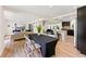 Open concept living space with a modern kitchen, sleek island, and hardwood floors at 4265 Hidden Valley Dr, South Fulton, GA 30349