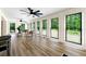 Sunroom featuring large windows, stylish decor, and plenty of natural light at 4265 Hidden Valley Dr, South Fulton, GA 30349