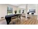 Open-concept living area with a dining table, hardwood floors, and stylish decor at 4265 Hidden Valley Dr, South Fulton, GA 30349