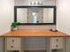 Vanity with patterned wallpaper, modern lighting and a decorative mirror at 4265 Hidden Valley Dr, South Fulton, GA 30349