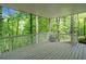 Spacious screened back deck overlooks a lush wooded backyard at 4365 Dover Crossing Dr, Marietta, GA 30066