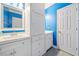 Bright bathroom featuring white cabinets, double sinks, and a stylish mirror at 4365 Dover Crossing Dr, Marietta, GA 30066